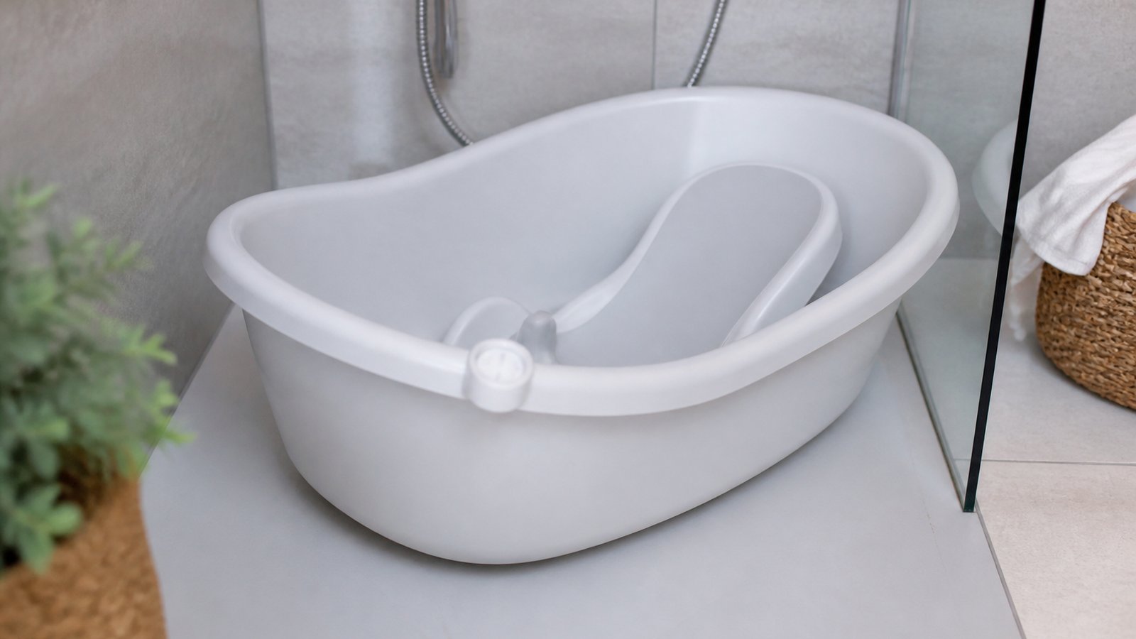 Freestanding baby bath with seat in a UK shower tray